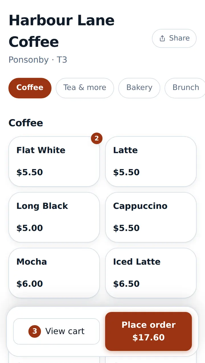Customer ordering screen with the café name, table number, category chips, menu tiles and a cart bar